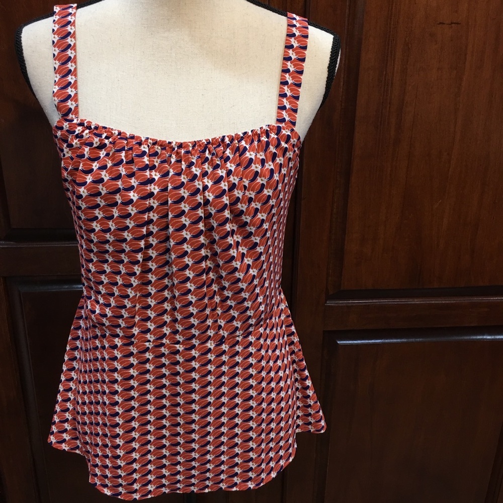 CAbi versatile sleeveless blouse. 100% polyester
